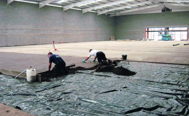 Applying screed on a warehouse floor